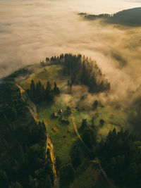 Fantastic sunrise on carpathian mountains. fog spreads on the valley of village, ukraine, 