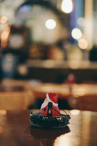 Close-up of santa claus figurine on table in church