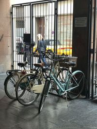 Side view of man on bicycle against building