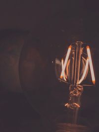 Close-up of illuminated light bulb