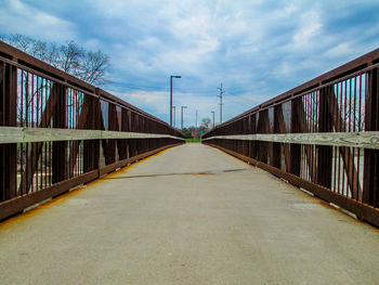 Footbridge against sky