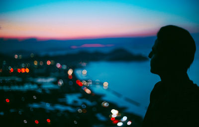 Close-up of woman in sea against sky