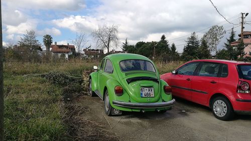 Vintage car on tree against sky