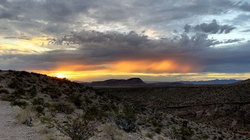 Scenic view of dramatic sky during sunset