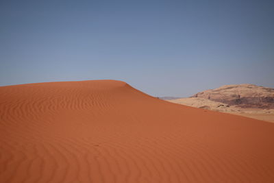 Scenic view of desert against clear sky