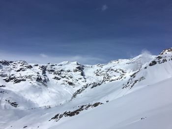 Snowcapped mountains against sky