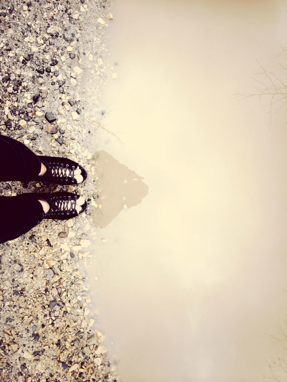 water, lifestyles, beach, leisure activity, low section, standing, person, sand, tranquility, copy space, unrecognizable person, shore, nature, clear sky, vacations, sea, wet