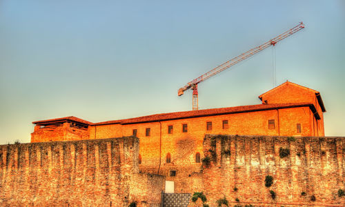 Low angle view of old building against clear sky