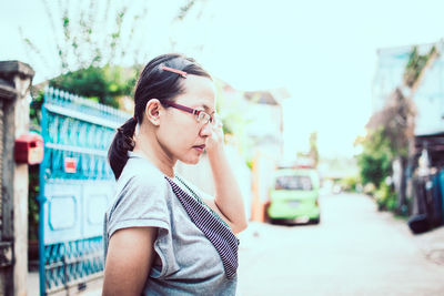 Portrait of young woman looking away