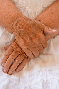 High angle view of woman lying on bed