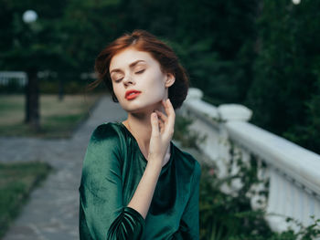 Portrait of a beautiful young woman with eyes closed