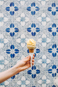 Close-up of hand holding ice cream cone