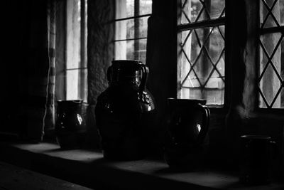 Close-up of wine glass on window sill