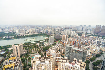 High angle view of city and buildings against sky