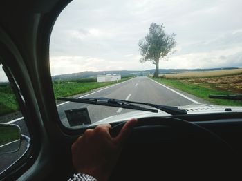 Cropped image of car on road