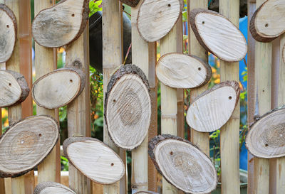 Close-up of clothes hanging on wooden logs