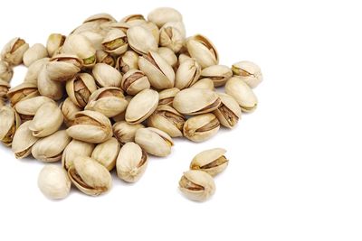 High angle view of roasted coffee on white background