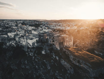 Aerial view of townscape against sky during sunset