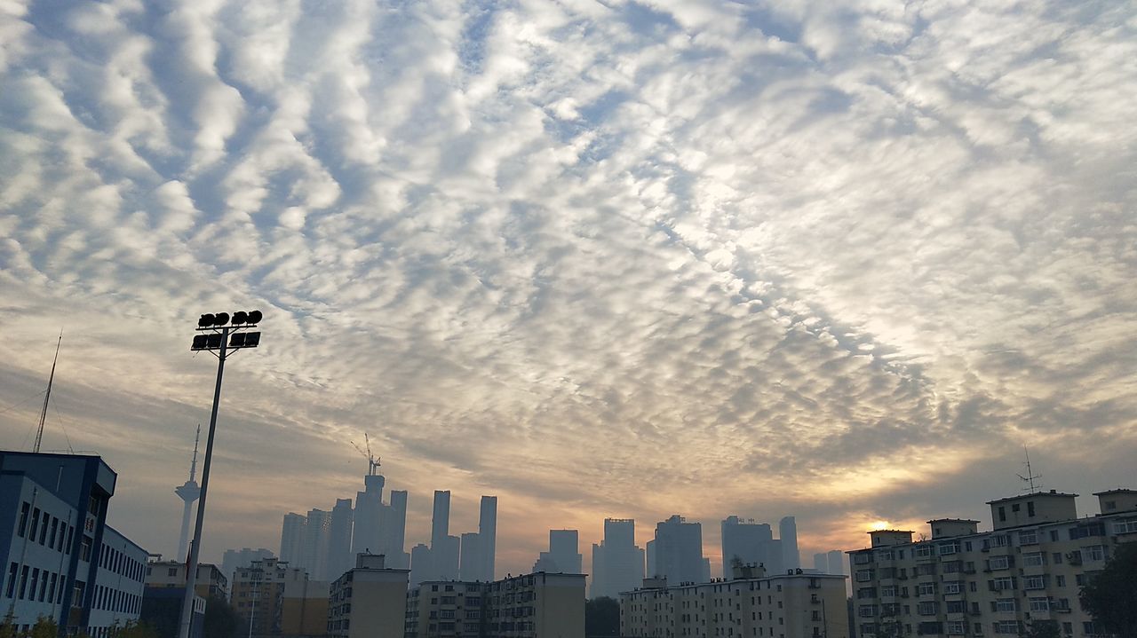 architecture, building exterior, built structure, cloud - sky, city, skyscraper, sky, cityscape, sunset, outdoors, urban skyline, no people, day, nature