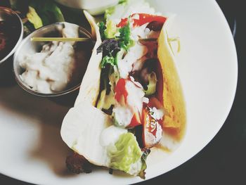 Close-up of taco served in plate on table