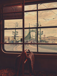 View of railroad track seen through window