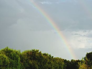Low angle view of rainbow against sky