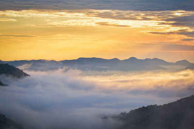 Low angle view of mountains against sky during sunset