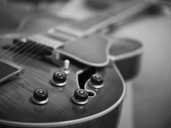 Close-up of guitar on table