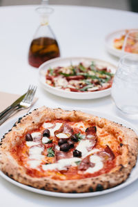 Close-up of pizza served on table