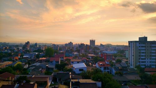 High angle view of buildings against sky during sunset