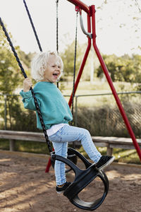 Happy child swinging
