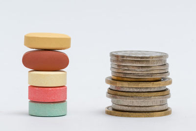 Close-up of stack of colored pencils over white background