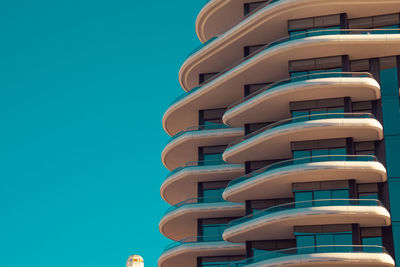 Low angle view of building against clear blue sky