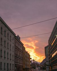 City against sky at sunset