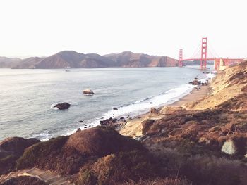 View of suspension bridge over sea