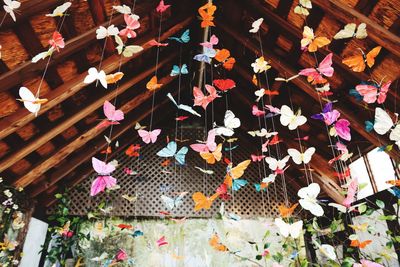 High angle view of multi colored decoration hanging on wood