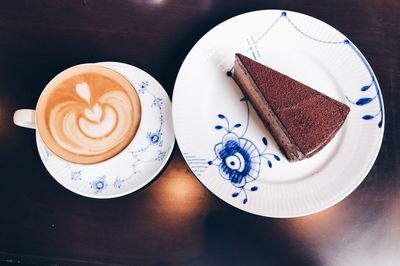 High angle view of coffee served on table