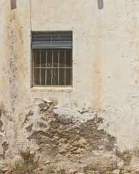 Low angle view of window on old building