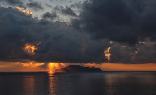 Scenic view of sea against sky during sunrise