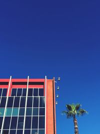 Low angle view of building against clear blue sky