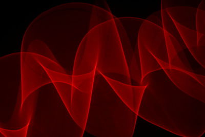 Close-up of light painting against black background