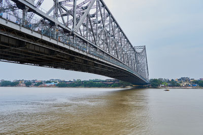 The howrah bridge spans the hooghly river in calcutta