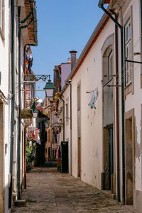 Street amidst buildings against sky