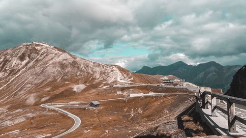 Scenic view of snowcapped mountain against cloudy sky