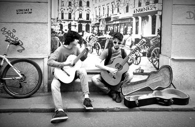 Men playing guitar