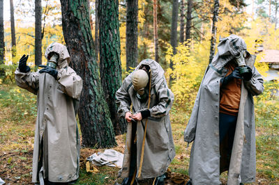 Rear view of man standing in forest