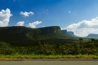 Scenic view of mountains against cloudy sky