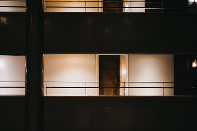 Illuminated building seen through glass window