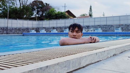 Portrait of man in swimming pool