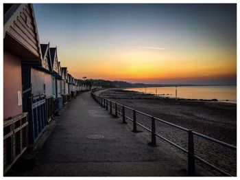 Scenic view of beach against sky during sunset